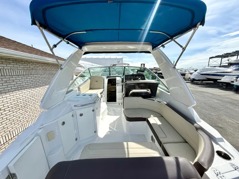 Slide: The Image of Interior view of 2019 Monterey SPORT YACHT 295 with blue canopy. - 6