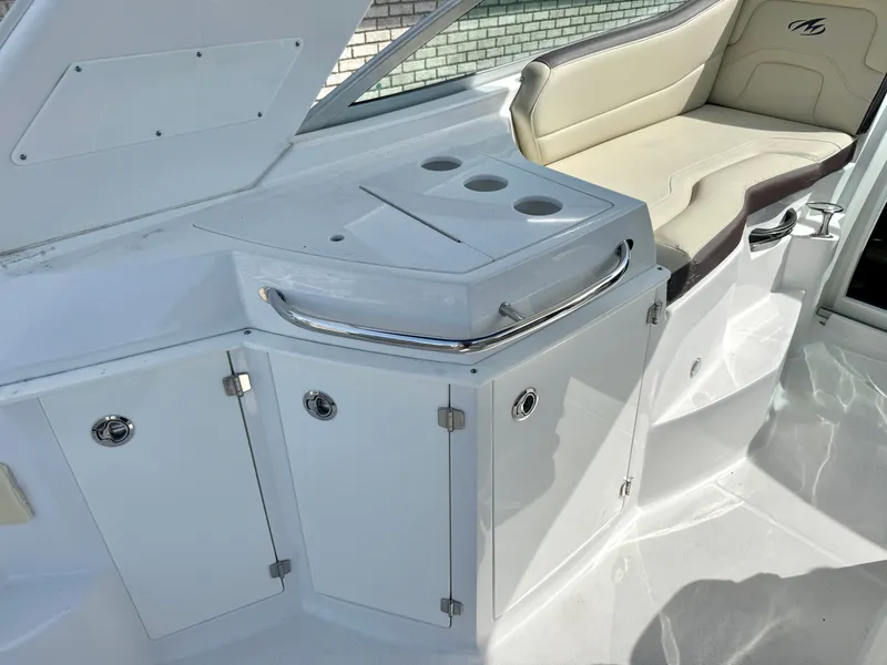 Slide: The Image of Interior of 2019 Monterey SPORT YACHT 295 with seating and storage. - 8