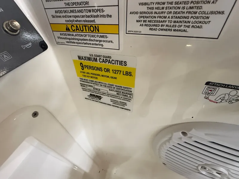 Slide: The Image of Sign shows maximum capacity: 9 persons or 1277 lbs. - 13