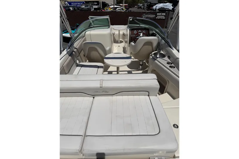 Slide: The Image of Interior view of 2010 Sea Ray 230 Sundeck boat with seating and helm. - 2