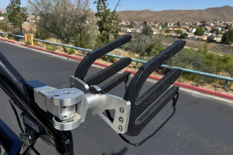 Slide: The Image of Wakeboard rack on a 2019 Moomba Max boat, mounted securely with a scenic background. - 18