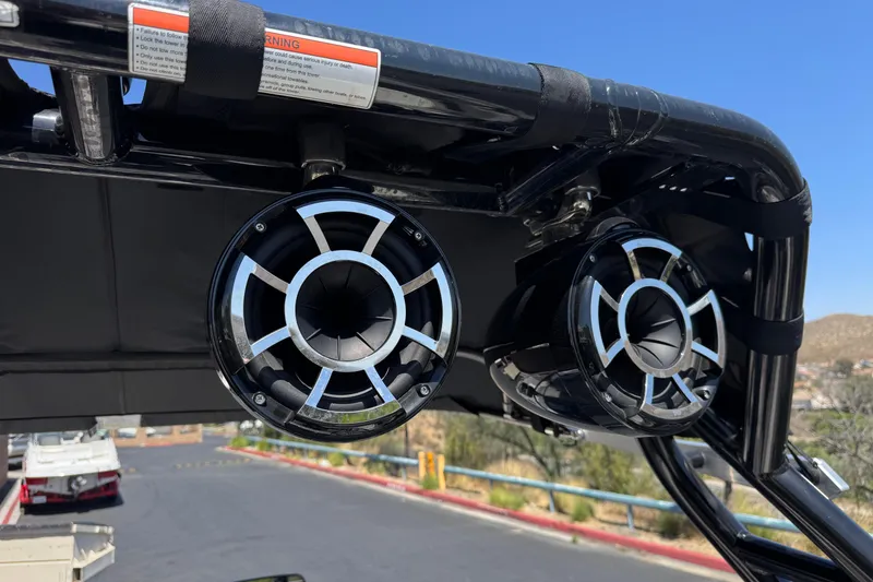 Slide: The Image of 2019 Moomba Max boat speakers mounted on a black frame under a clear blue sky. - 19
