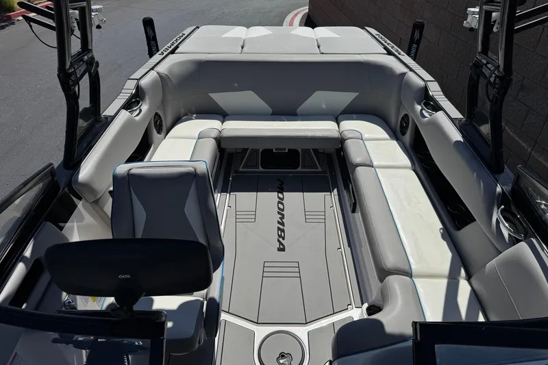 Slide: The Image of 2019 Moomba Max boat interior with gray seating and sleek design. - 20
