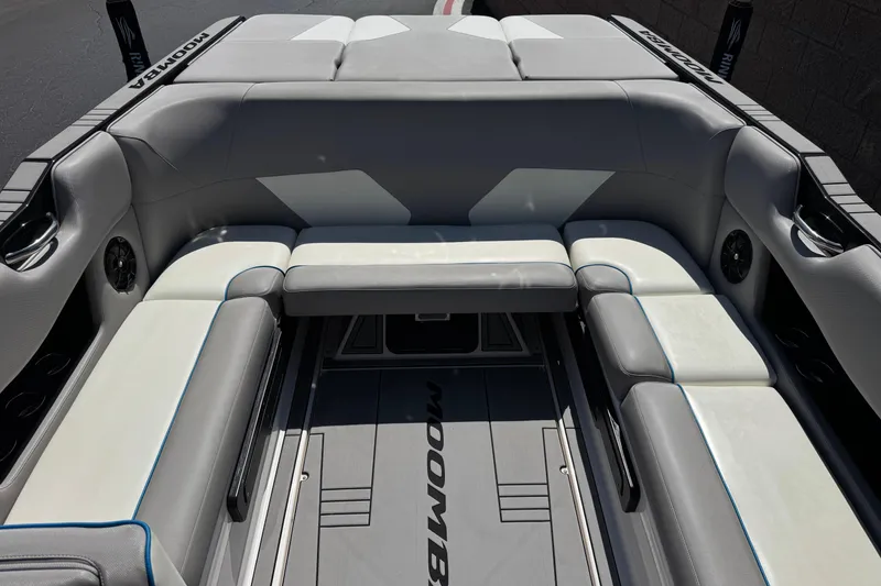 Slide: The Image of 2019 Moomba Max boat interior with gray and white seating, featuring sleek design and spacious layout. - 21