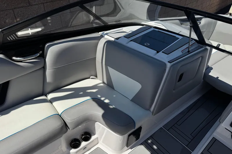 Slide: The Image of 2019 Moomba Max boat interior with gray seating and cup holders. - 26