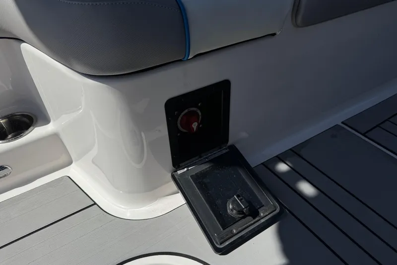 Slide: The Image of 2019 Moomba Max boat interior with open storage compartment and seating. - 28