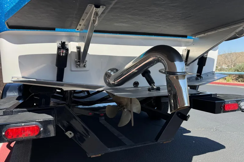 Slide: The Image of Rear view of a 2019 Moomba Max boat showing exhaust and propeller details. - 7