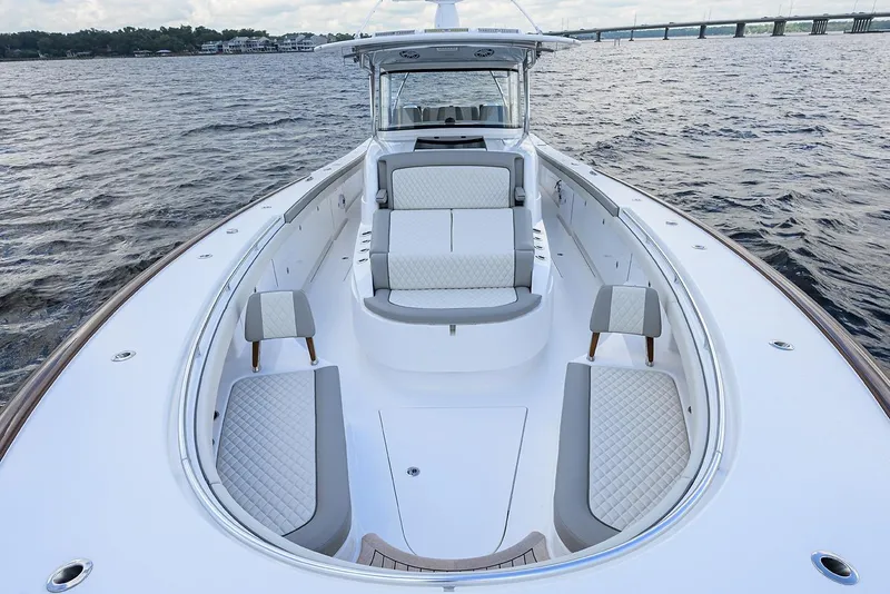 Slide: The Image of 2026 Valhalla V-46 boat with luxurious seating on open water. - 12