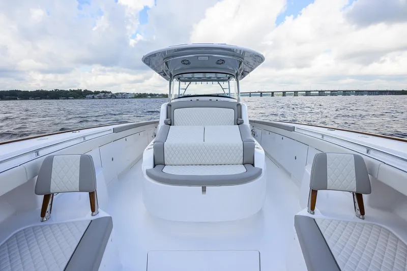 Slide: The Image of Luxurious 2026 Valhalla V-46 boat interior with elegant seating on open water. - 13