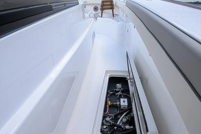 Slide: The Image of 2026 Valhalla V-46 boat deck with open hatch revealing internal components. - 15