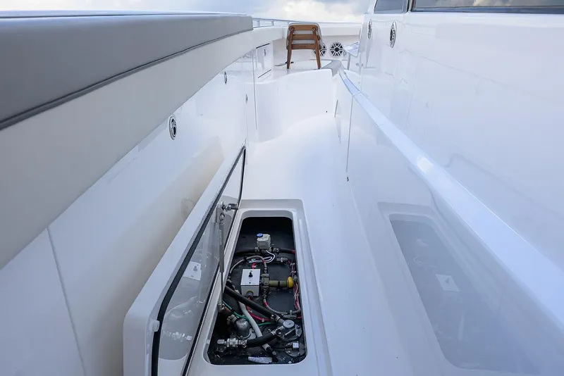 Slide: The Image of 2026 Valhalla V-46 yacht deck with open storage compartment, showcasing sleek design. - 16