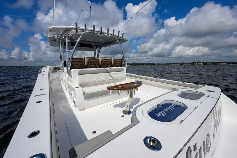 Slide: The Image of 2026 Valhalla V-46 boat on open water, featuring sleek design and spacious seating. - 17