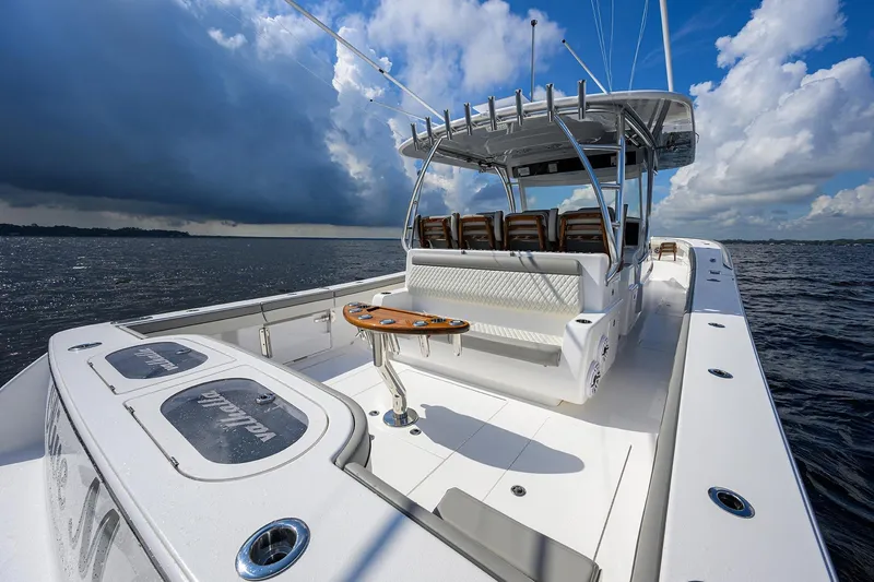 Slide: The Image of Valhalla V-46 2026 boat on open water under dramatic cloudy sky. - 19