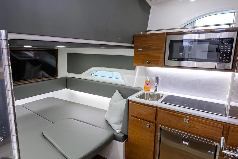 Slide: The Image of Luxurious interior of 2026 Valhalla V-46 yacht with modern kitchen and seating area. - 24