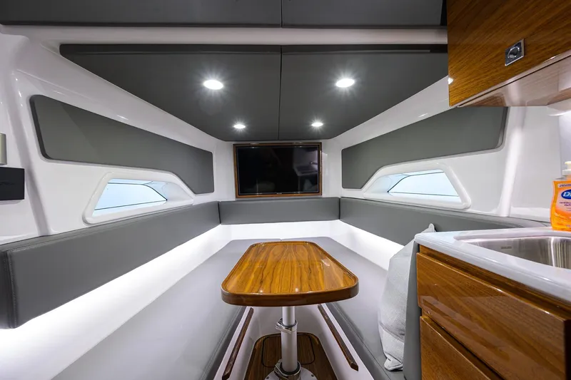 Slide: The Image of Luxurious interior of 2026 Valhalla V-46 yacht with modern seating and wooden table. - 26