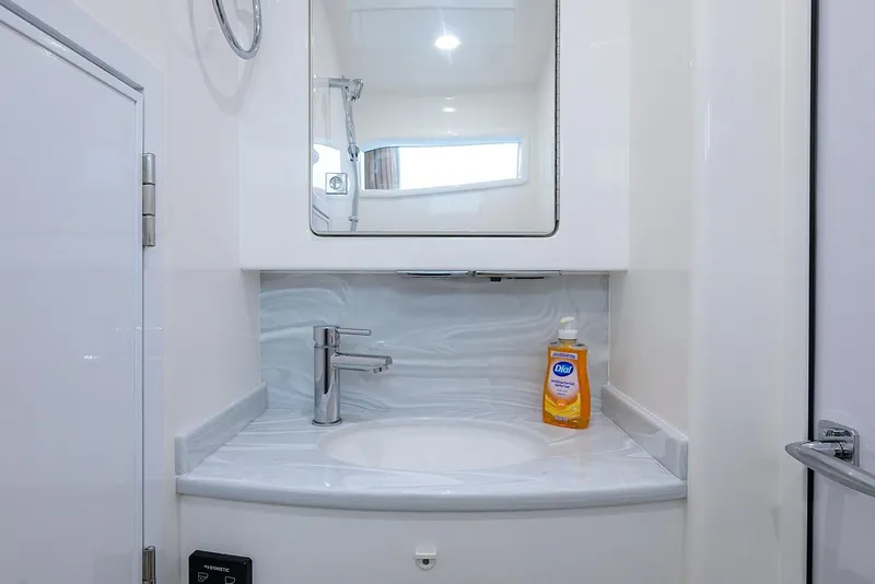 Slide: The Image of Modern bathroom sink in 2026 Valhalla V-46 yacht, featuring sleek design and soap dispenser. - 28