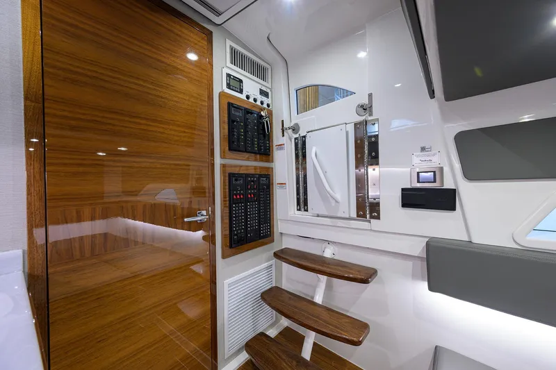Slide: The Image of Interior of 2026 Valhalla V-46 yacht with wooden door, control panels, and modern design. - 29