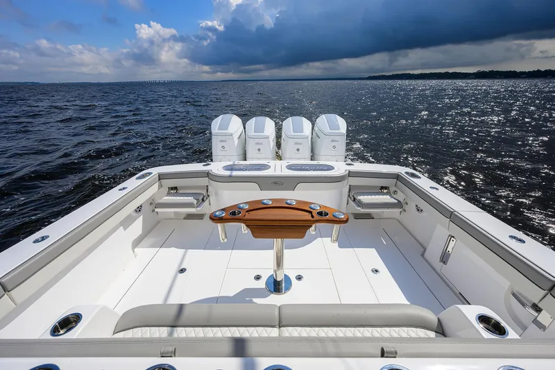 Slide: The Image of 2026 Valhalla V-46 boat deck with four engines on open water. - 30