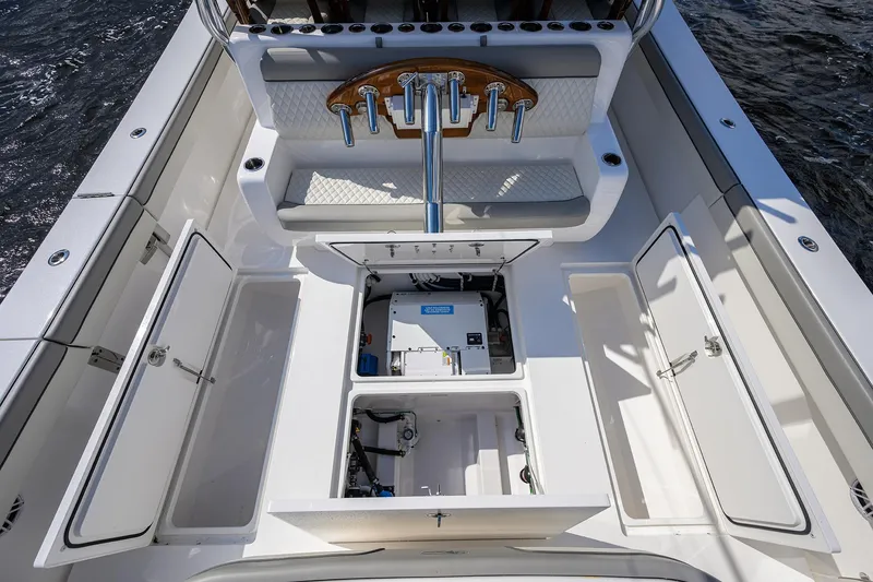 Slide: The Image of 2026 Valhalla V-46 boat interior with open storage compartments and seating. - 31