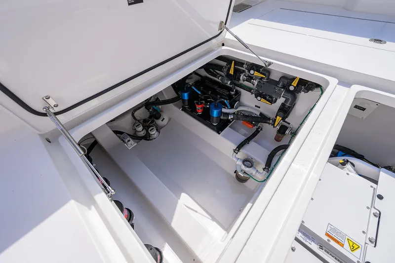 Slide: The Image of Open engine compartment of 2026 Valhalla V-46 boat, showcasing mechanical components. - 32
