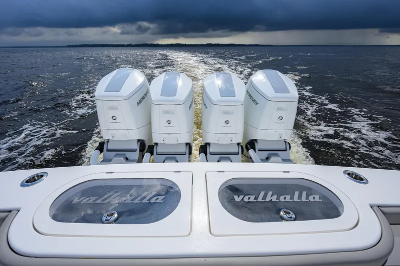 Slide: The Image of Valhalla V-46 boat with four Mercury engines cruising on open water, 2026 model. - 37