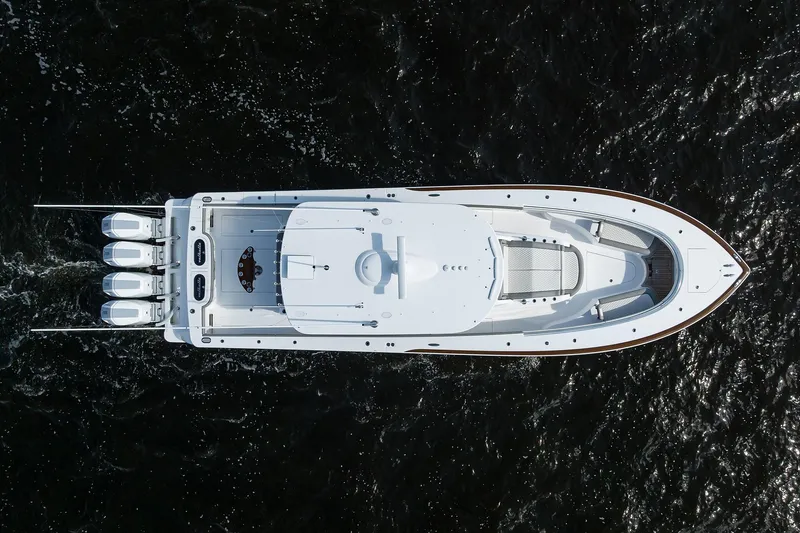 Slide: The Image of Aerial view of 2026 Valhalla V-46 boat cruising on dark water. - 4