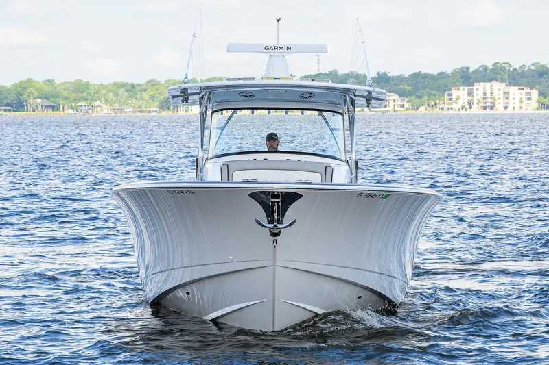Slide: The Image of 2026 Valhalla V-46 boat cruising on a scenic lake with modern design. - 5