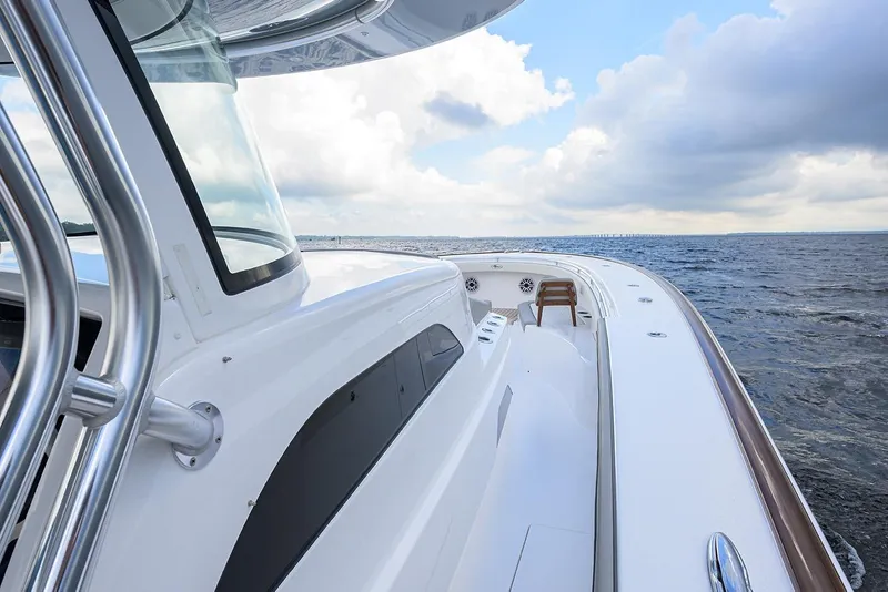 Slide: The Image of Valhalla V-46 yacht cruising on open sea, 2026 model, sleek design, clear skies. - 8