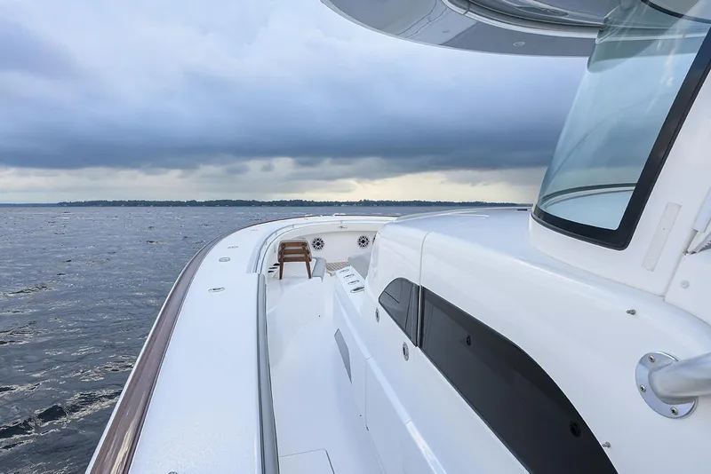 Slide: The Image of 2026 Valhalla V-46 yacht on open water under cloudy skies. - 9