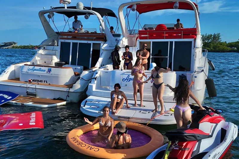 Slide: The Image of People enjoying a day on Sea Ray 450 Express Bridge yachts, Miami waters, 2002 model. - 13