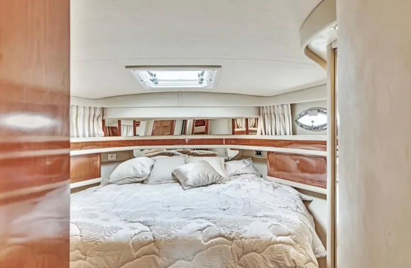 Slide: The Image of Luxurious bedroom interior of 2002 Sea Ray 450 Express Bridge yacht. - 30