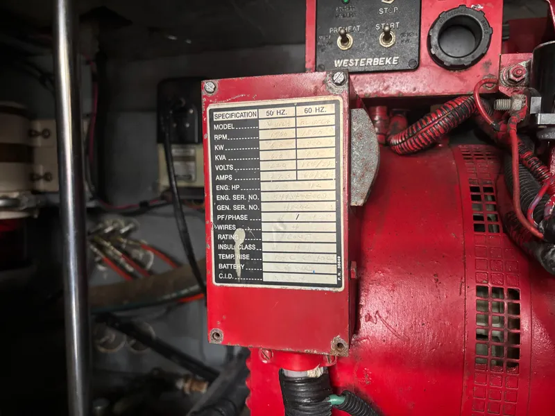 Slide: The Image of Close-up of a Westerbeke generator label inside a 2002 Sea Ray 450 Express Bridge. - 48