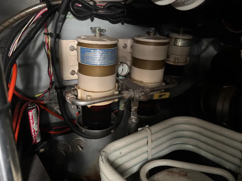 Slide: The Image of Engine compartment of 2002 Sea Ray 450 Express Bridge, showing fuel filters and wiring. - 50