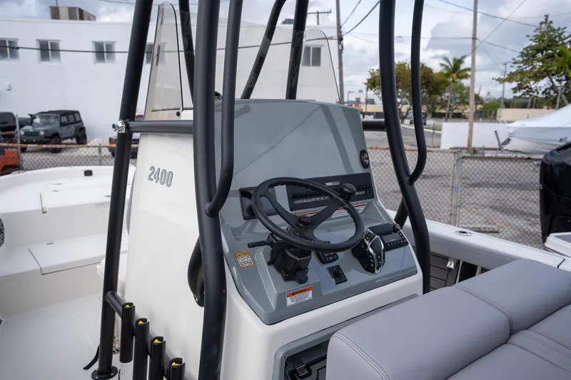 Slide: The Image of 2025 Pathfinder 2400 Open boat console with steering wheel and controls. - 11
