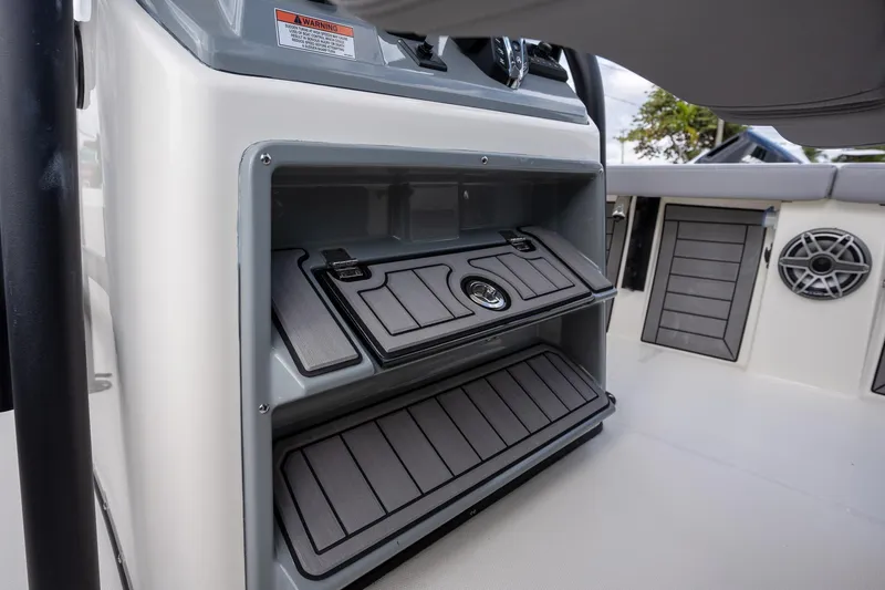 Slide: The Image of 2025 Pathfinder 2400 Open boat console storage with sleek design and modern features. - 12