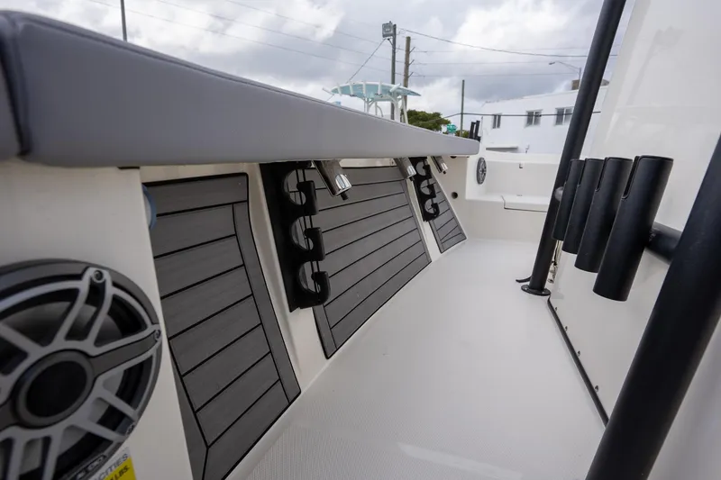 Slide: The Image of 2025 Pathfinder 2400 Open boat interior with rod holders and speakers. - 13