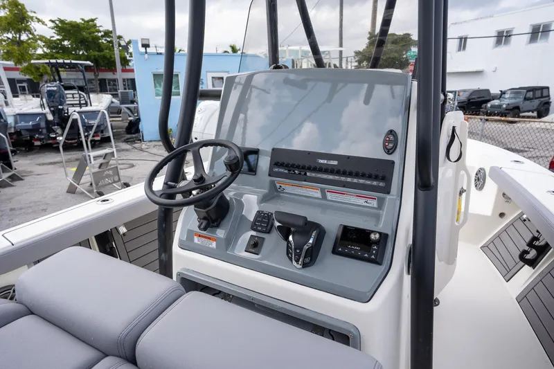 Slide: The Image of 2025 Pathfinder 2400 Open boat dashboard with steering wheel and controls. - 7