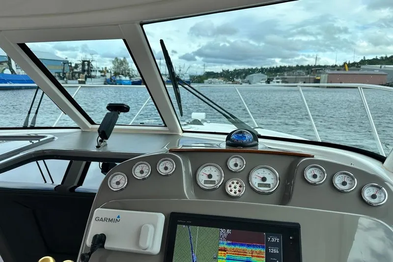 Slide: The Image of Cockpit view of 2018 Tiara Yachts 31 with Garmin navigation system on a cloudy day. - 10