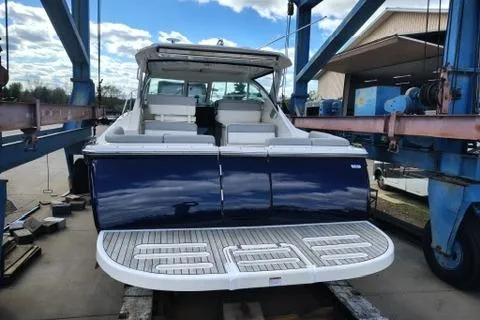 Slide: The Image of 2018 Tiara Yachts 31 model on a lift, showcasing sleek design and spacious seating. - 4