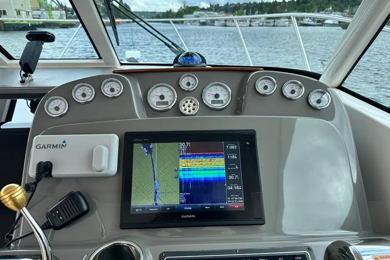 Slide: The Image of Dashboard of a 2018 Tiara Yachts 31 with Garmin navigation system and gauges. - 8