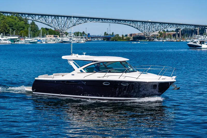 Slide: The Image of 2018 Tiara Yachts 31 cruising on a scenic Seattle backdrop. - 0