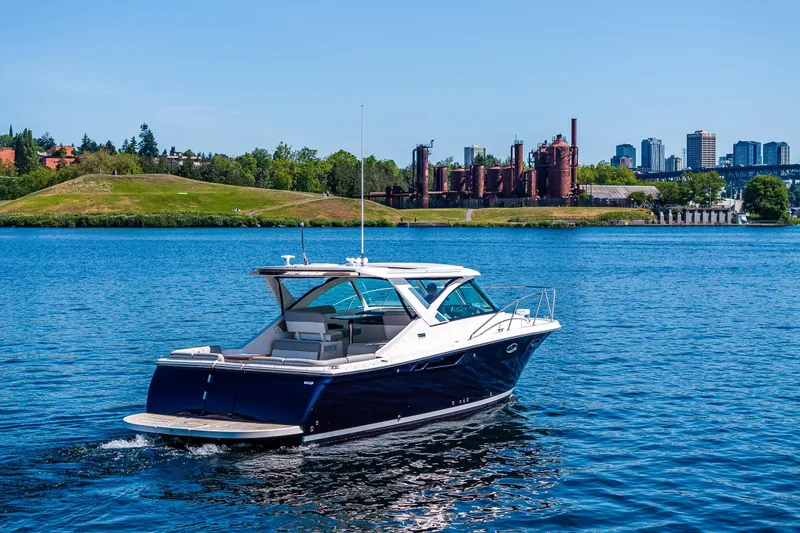 Slide: The Image of 2018 Tiara Yachts 31 cruising on a scenic Gasworks Park with city University backdrop. - 1