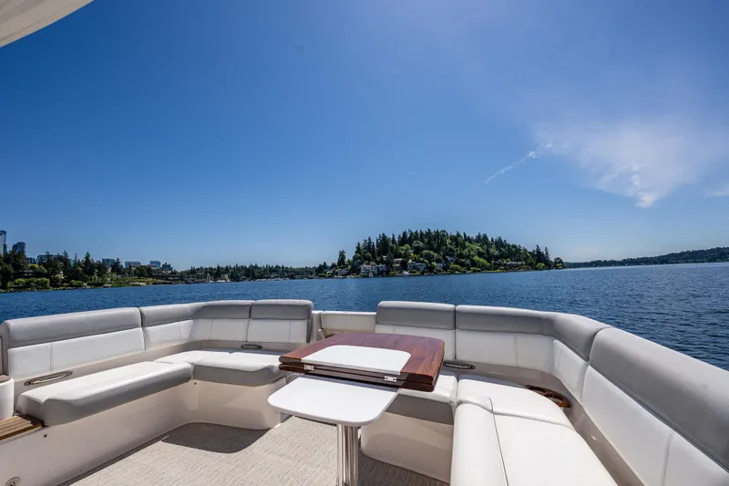 Slide: The Image of Luxurious 2018 Tiara Yachts 31 with spacious seating, cruising under blue skies. - 12