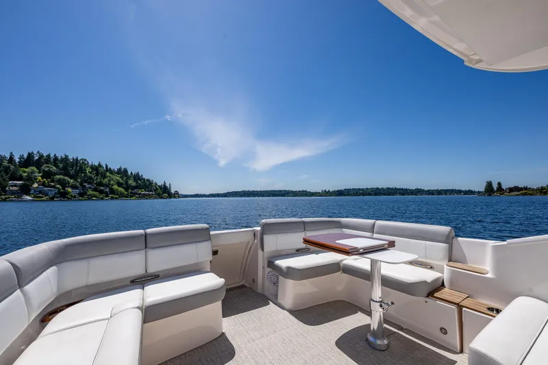Slide: The Image of 2018 Tiara Yachts 31 on serene lake with blue sky. - 16