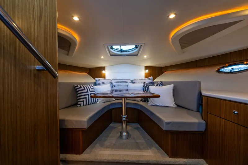 Slide: The Image of Luxurious interior of 2018 Tiara Yachts 3100 Coronet with elegant seating and ambient lighting. - 24