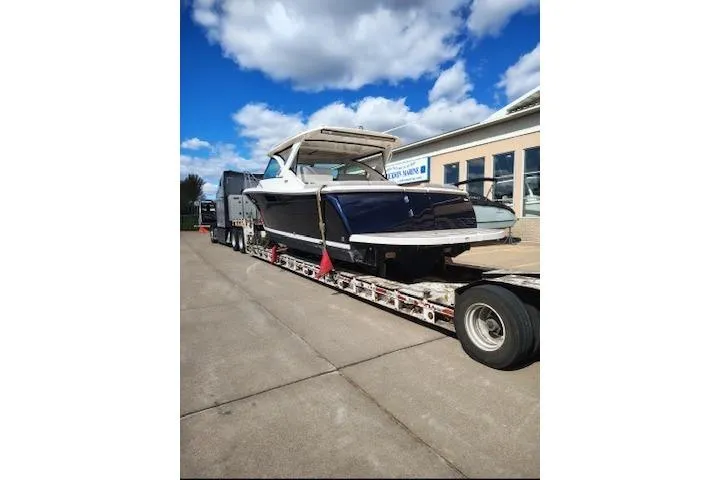 Slide: The Image of 2018 Tiara Yachts 31 on trailer under blue sky, ready for transport. - 26