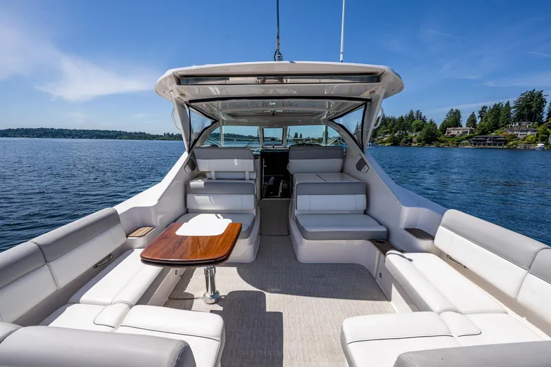 Slide: The Image of 2018 Tiara Yachts 3100 Coronet interior with seating, table, and scenic water view. - 33