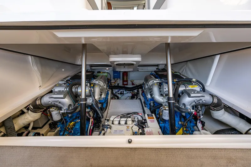 Slide: The Image of Engine compartment of a 2018 Tiara Yachts 31, showcasing dual engines and mechanical components. - 44