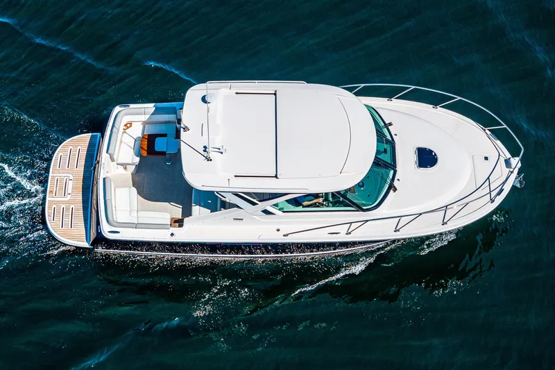 Slide: The Image of Aerial view of 2018 Tiara Yachts 31 cruising on open water. - 9