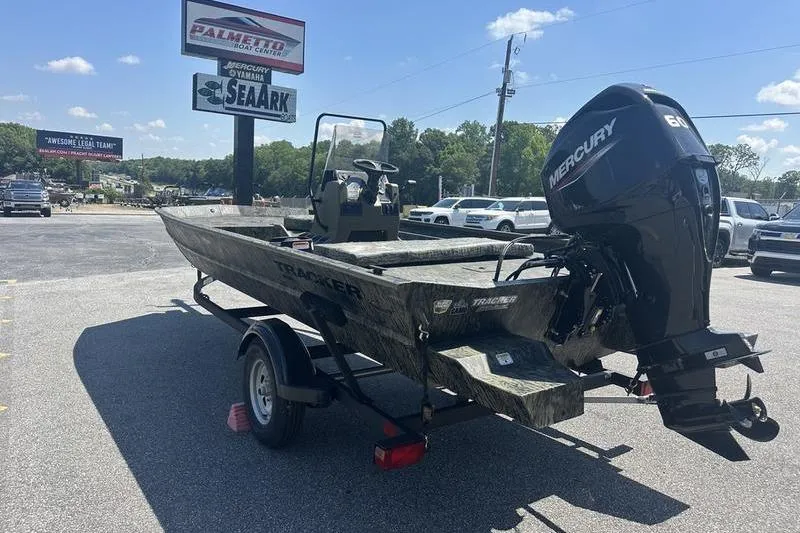 Slide: The Image of 2026 Tracker Grizzly 1860 CC boat with Mercury engine on trailer in parking lot. - 8